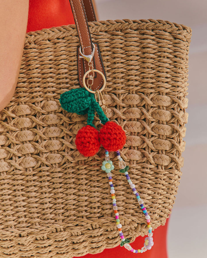 Nylah Woven Charm Straw Tote Bag