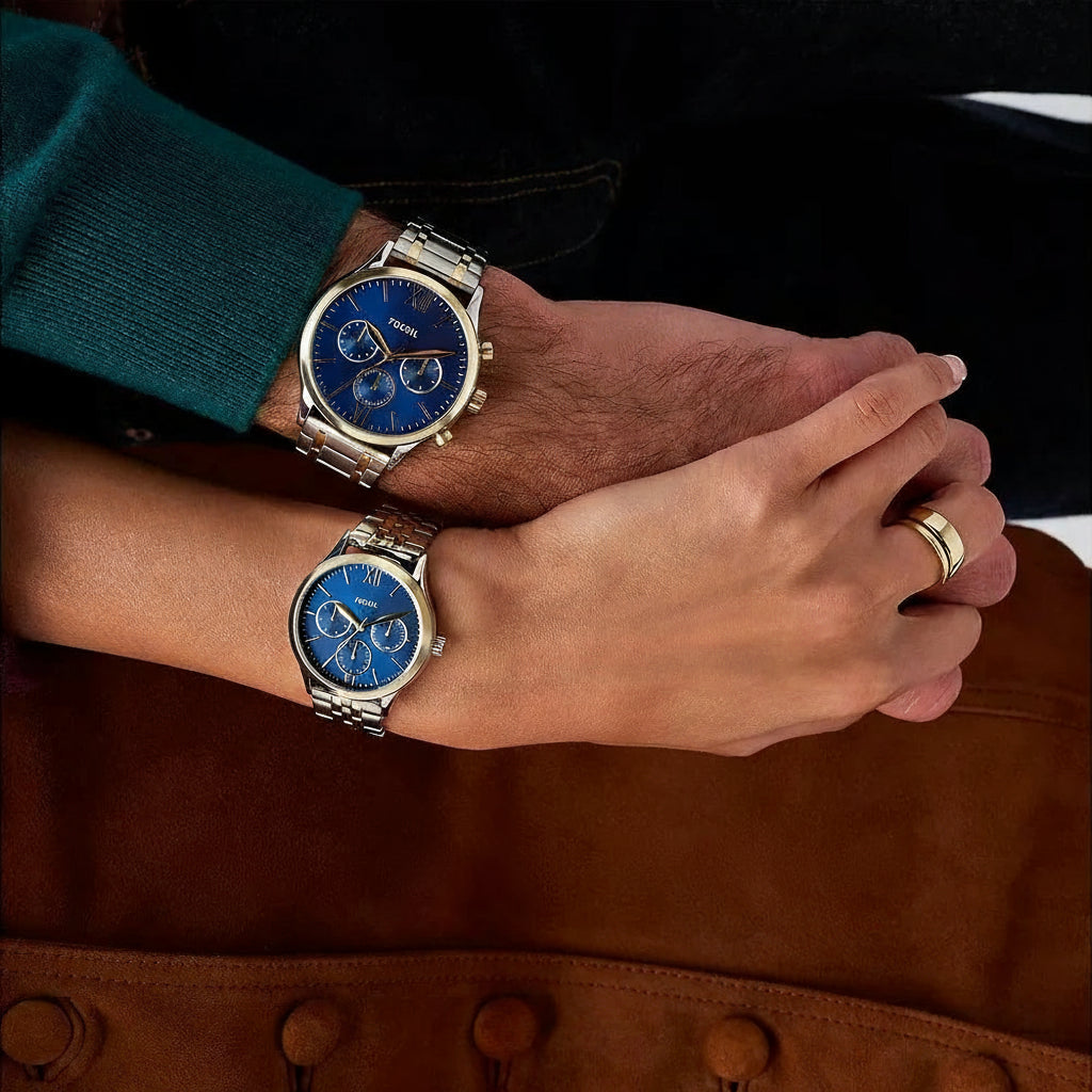 Two people wearing matching watches without a text on a brown textured background.